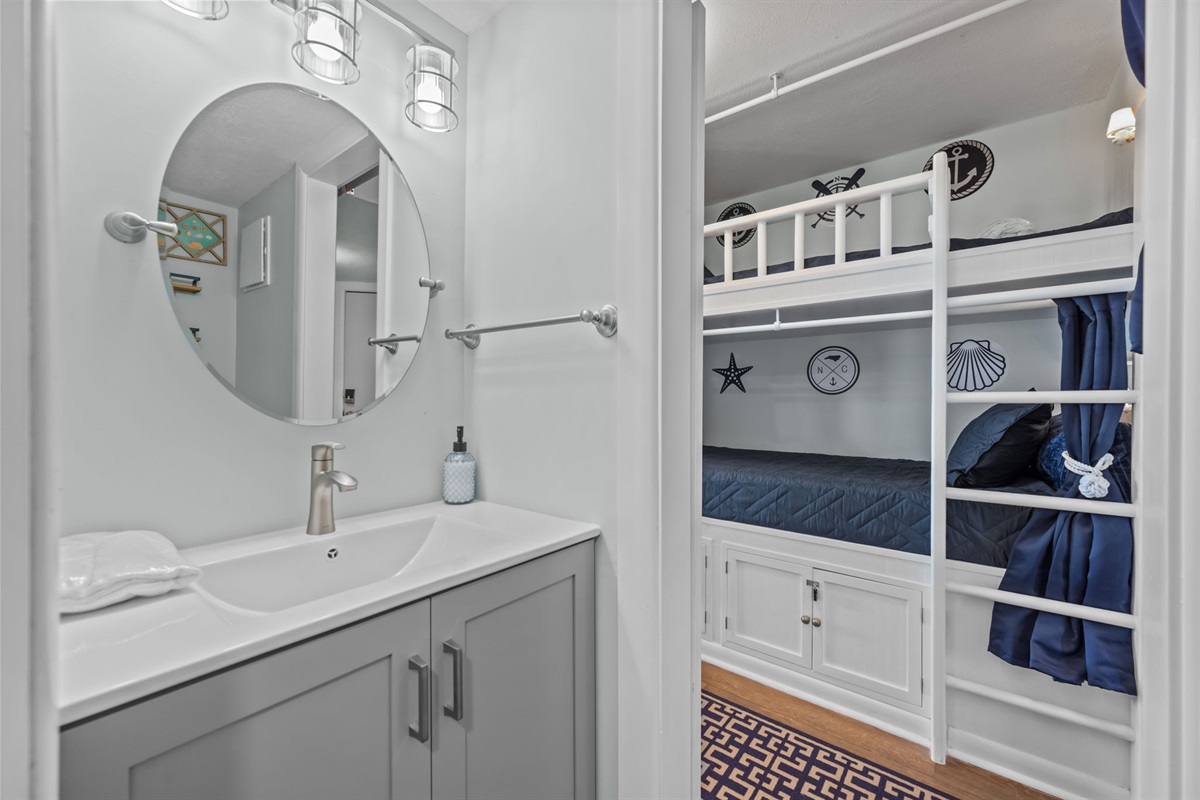 Updated bathroom with clean finishes and easy access from the bunk area