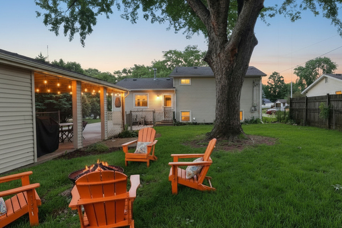 End the day around the fire pit under glowing café lights and mature shade trees.