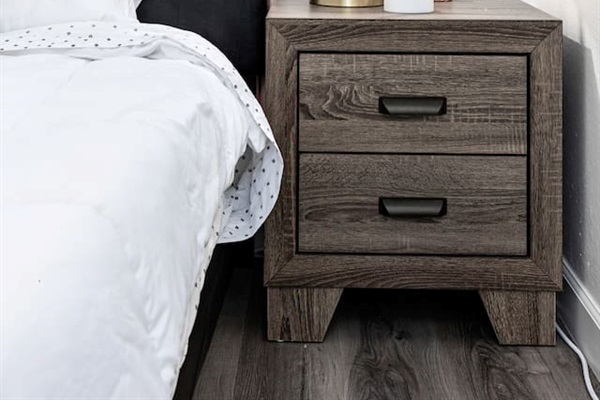 Thoughtfully styled with a cozy lamp, heart-shaped light, and decorative plant, your nightstand adds personality and warmth.

