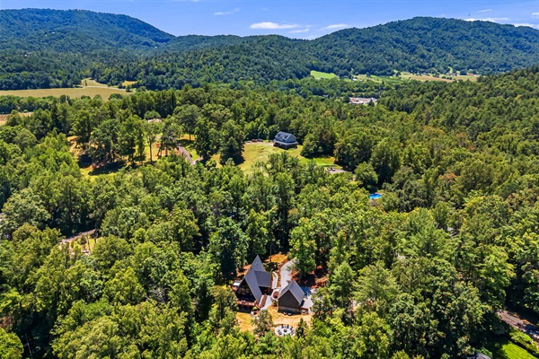 The A-Frame sits on beautiful 2 acres and its surrounded by mature trees, within a quiet neighborhood.