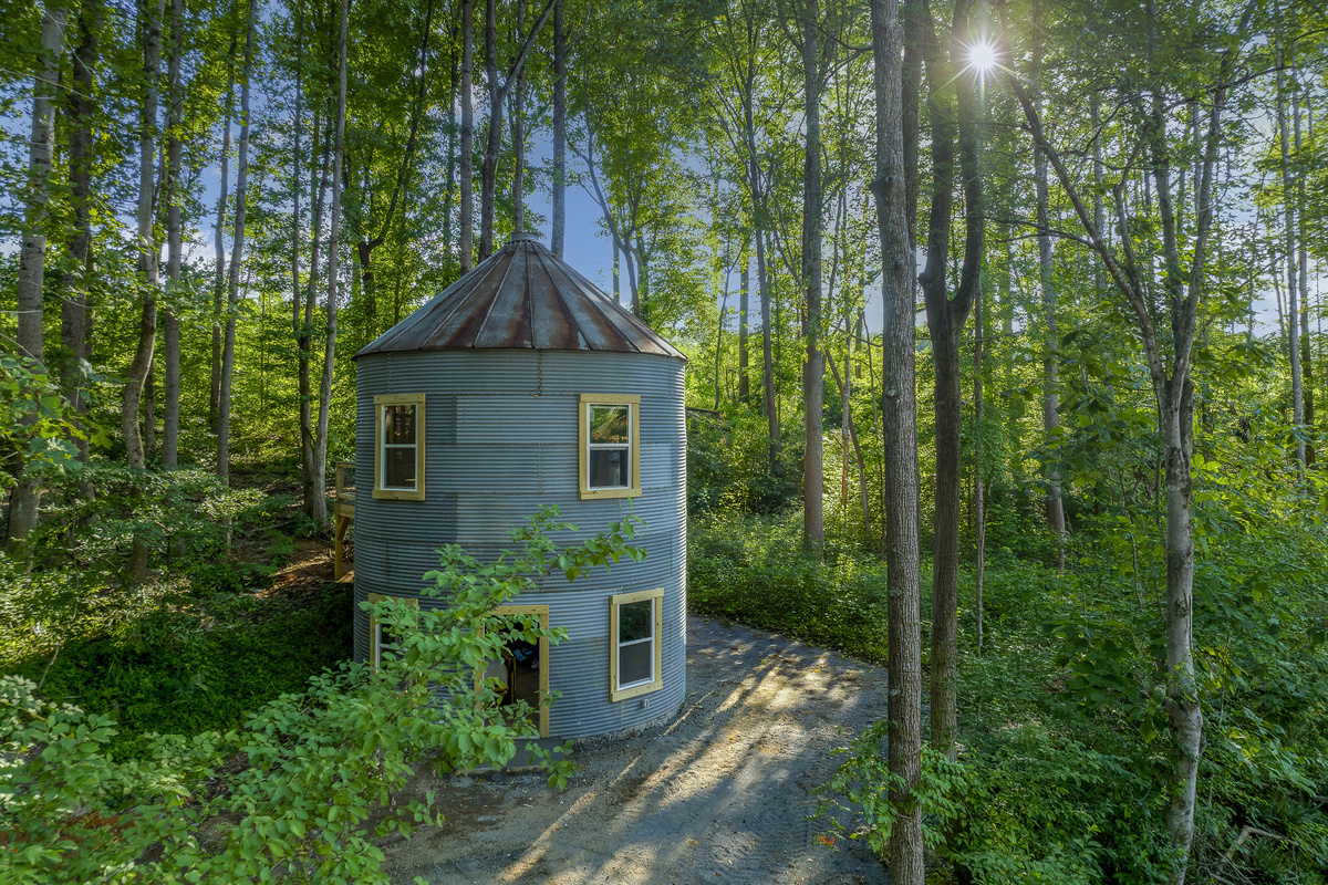 Unique Retreat: Experience a charming, cylindrical getaway nestled among lush forests!