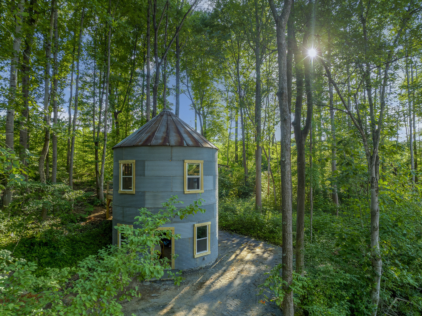 Unique Retreat: Experience a charming, cylindrical getaway nestled among lush forests!