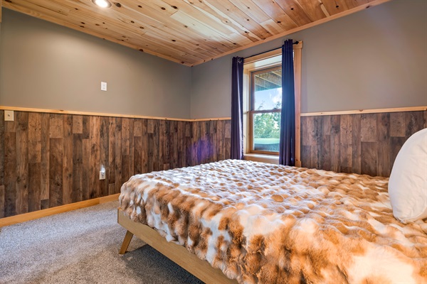 Located on the lower level, the third bedroom is connected to the bunk room, with a door for privacy.