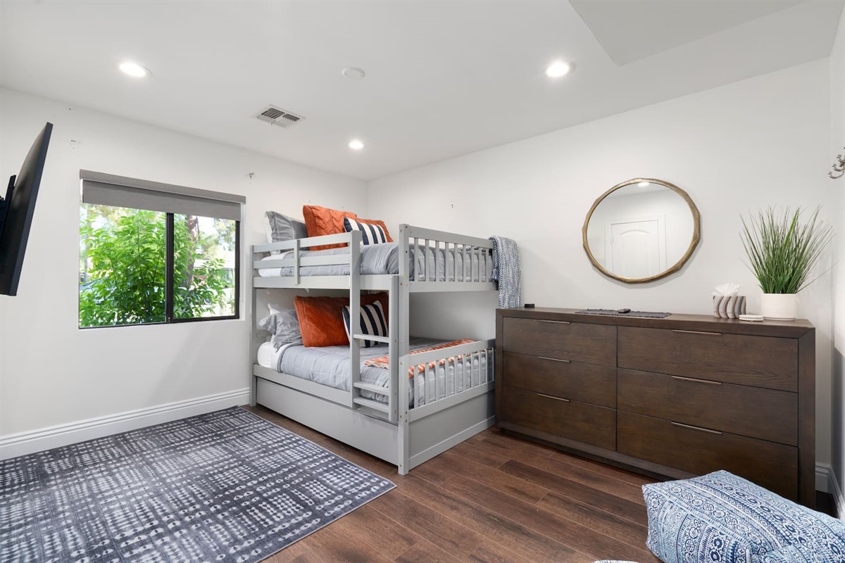 Full bunk over full bunk with a full bed that pulls out from under it!