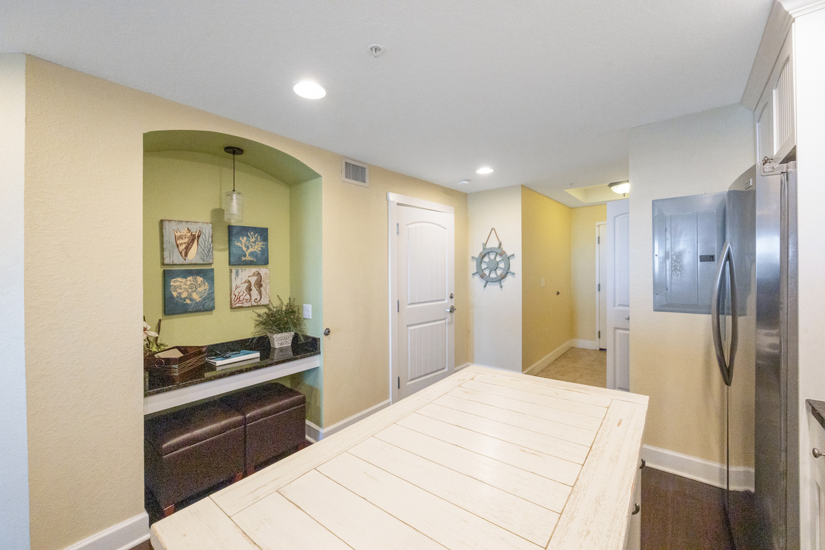 Kitchen - fully equipped w/ a microwave, dishwasher, full-size fridge, Mr. Coffee, range, stackable washer/dryer, pots/pans, dishes, and silverware. Workstation for those of you who have to check in with the office while on vacation.