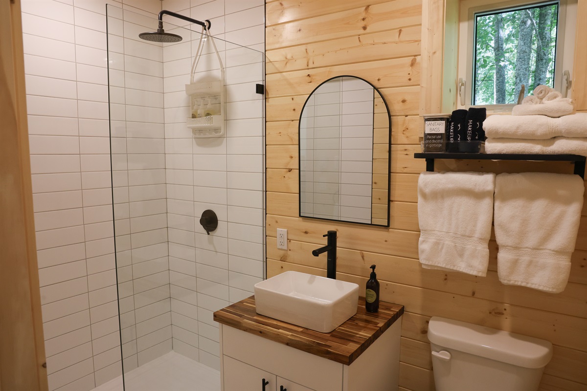 Premium bathroom with standing shower and non-toxic, Canadian made soaps by Oneka