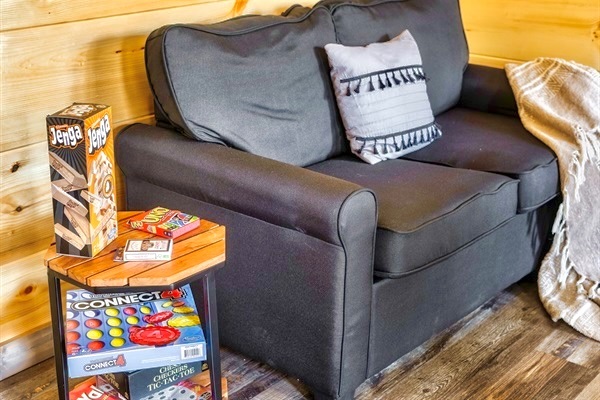 Board games galore! Enjoy endless fun and laughter with family and friends, perfect for a cozy game night inside the cabin.