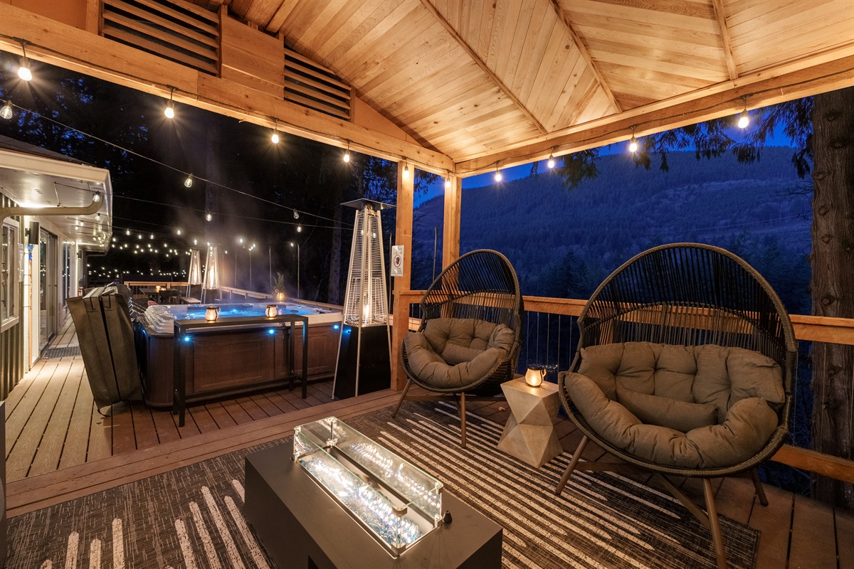 Enjoy the best of both worlds—mountain views, a steaming hot tub, and a fire-lit covered lounge with ultra-comfy chairs for relaxing after a day on the slopes or trails.