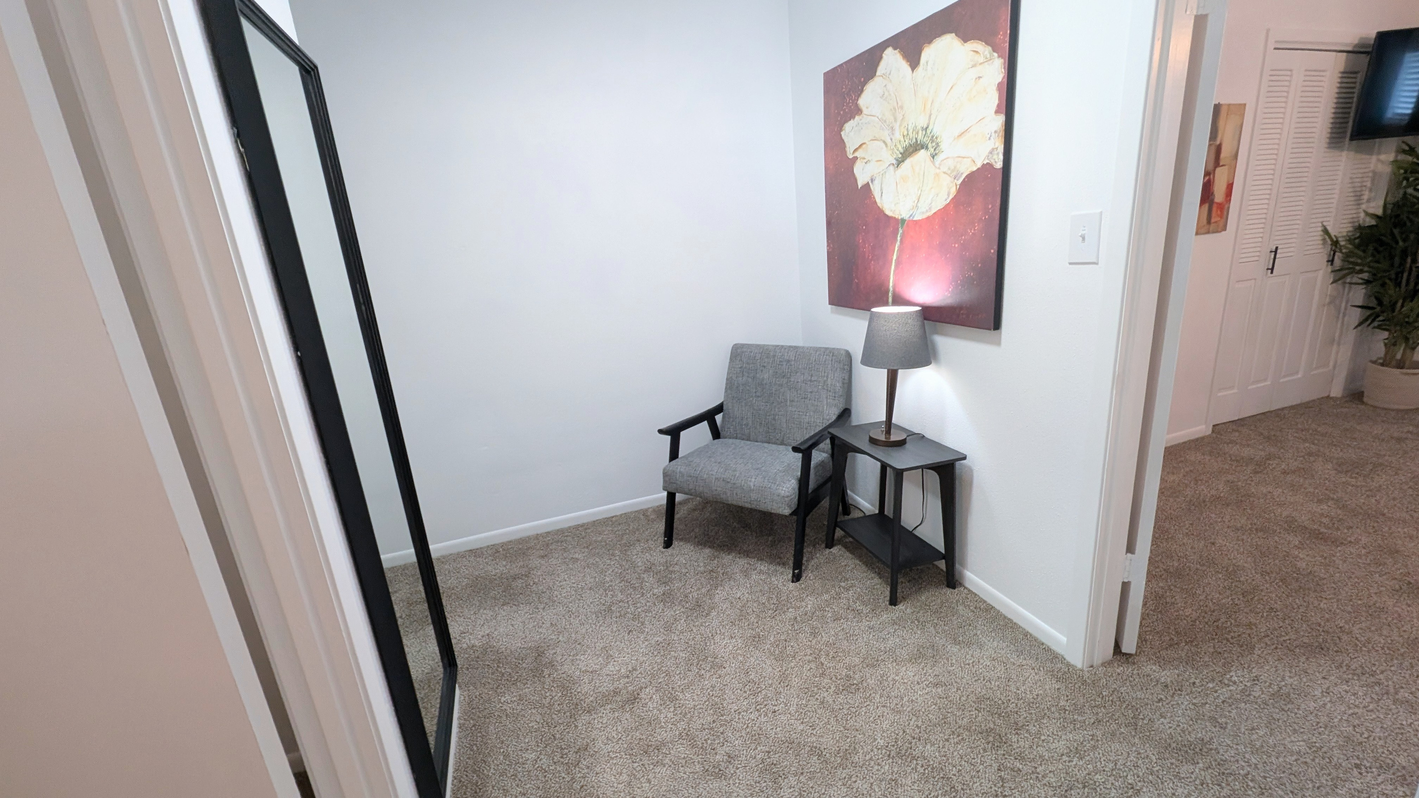 A full-length mirror on the landing adds convenience for getting ready.