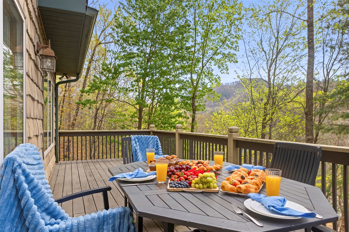 Deck: Savor breakfast with stunning mountain views and fresh fruit galore!