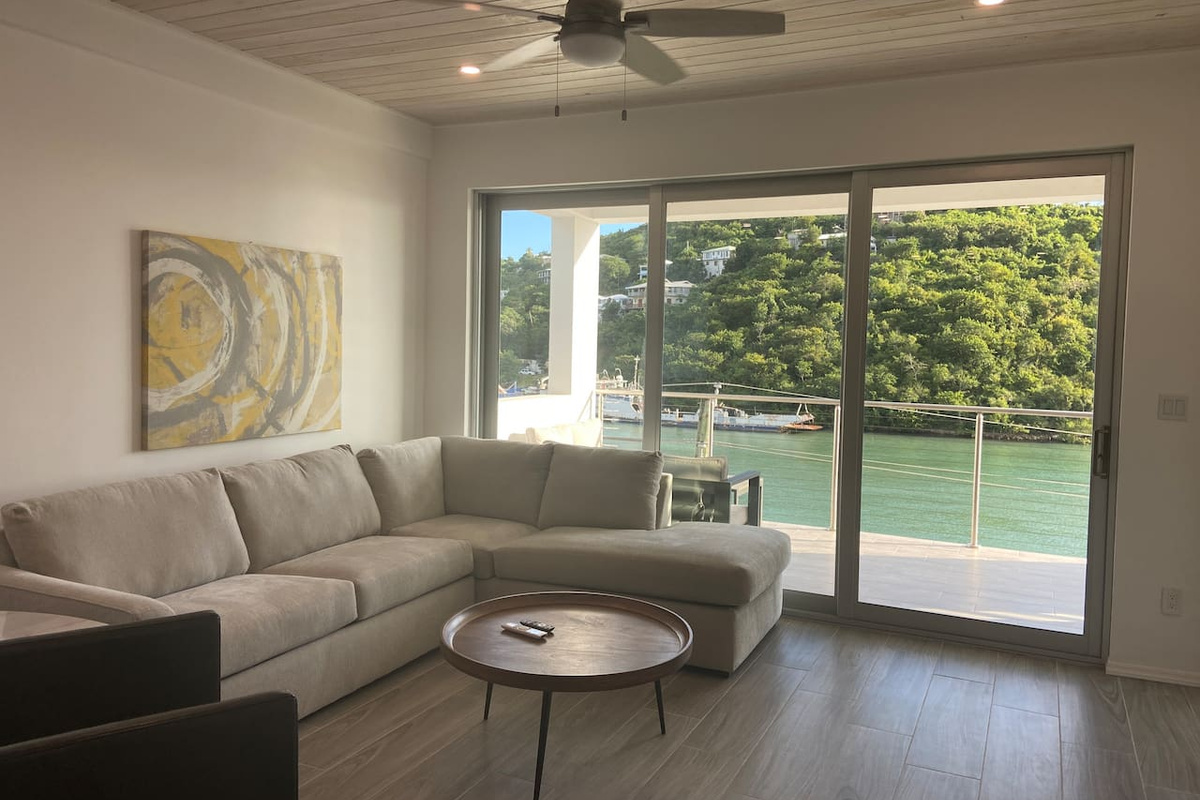 Living area with fabulous waterfront views.   Enjoy watching movies/sports on a 
70” flat screen TV.