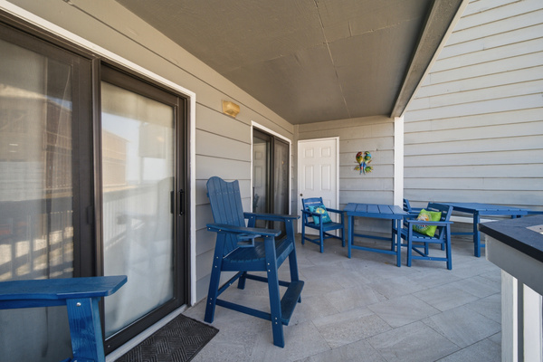 Private covered balcony with bistro-style seating