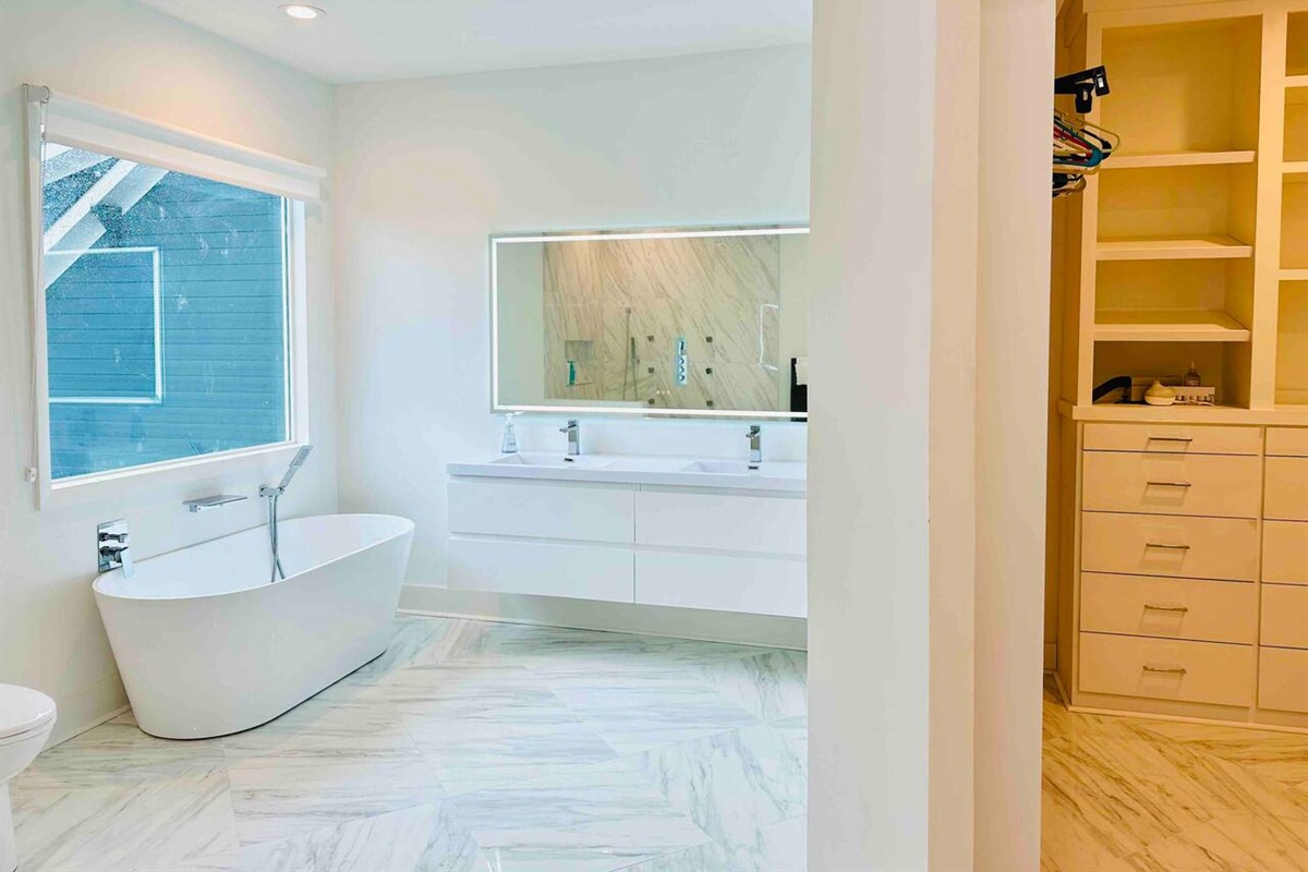 A double vanity and large walk-in shower create the perfect setting for getting ready for a night out in Charlotte. 