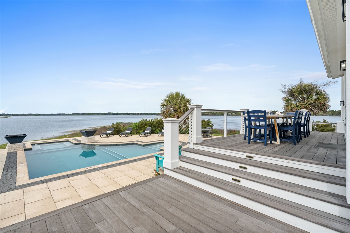 Resort-style pool and elevated dining deck with unbeatable waterfront scenery