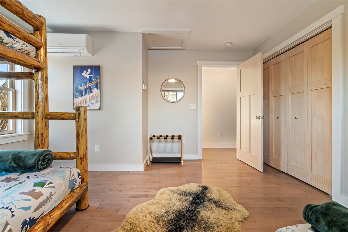 Spacious bedroom for kids or multi-family stays with bunk bed and double bed.