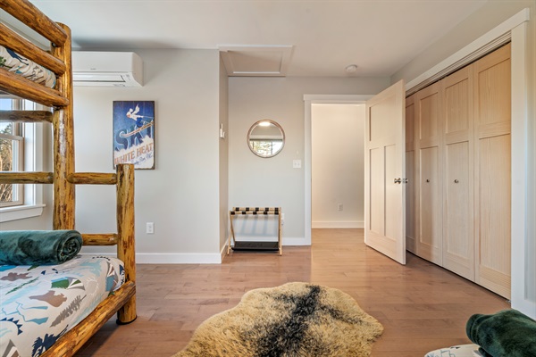 Spacious bedroom for kids or multi-family stays with bunk bed and double bed.