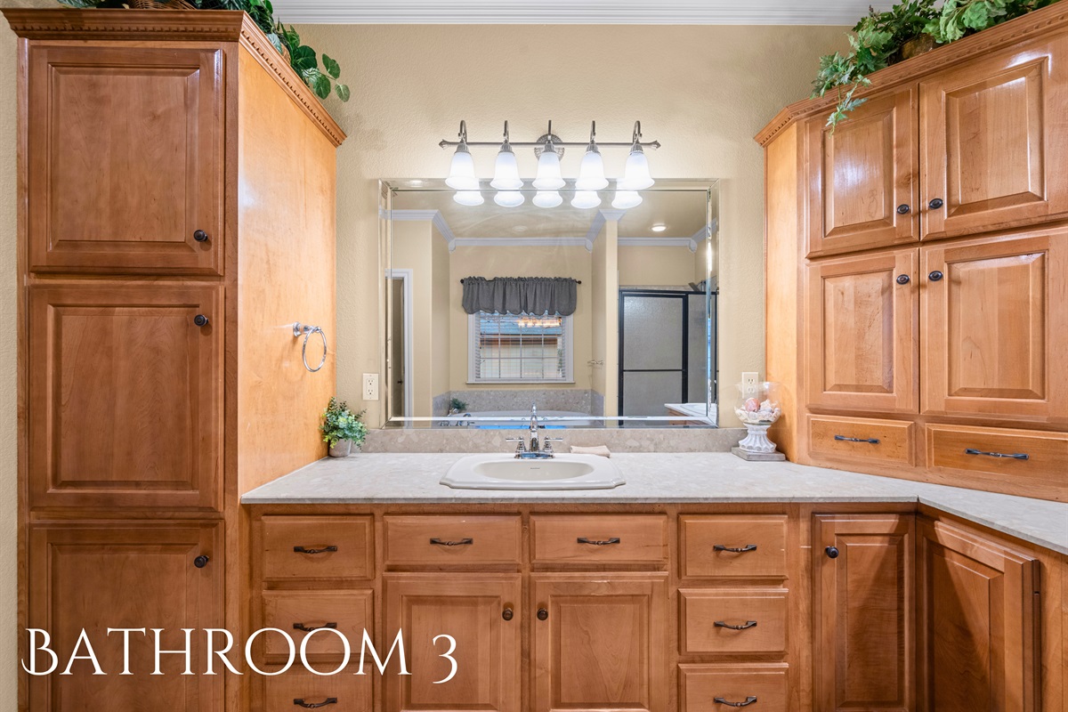 Bathroom 3 with dual vanities and plenty of storage.