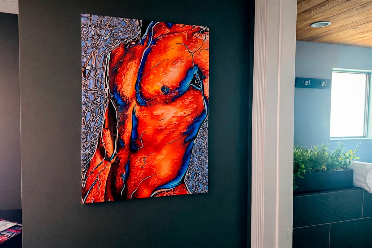 Modern statement artwork featured in The Red Room, enhancing the room’s distinctive design aesthetic.