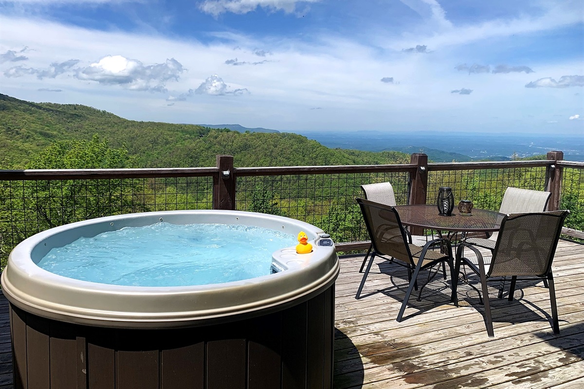 Private hot tub, peaceful deck, and long-range mountain scenery.
