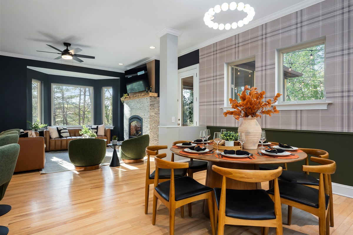 Open dining and living area with natural light throughout - ideal for group meals before heading into downtown Asheville