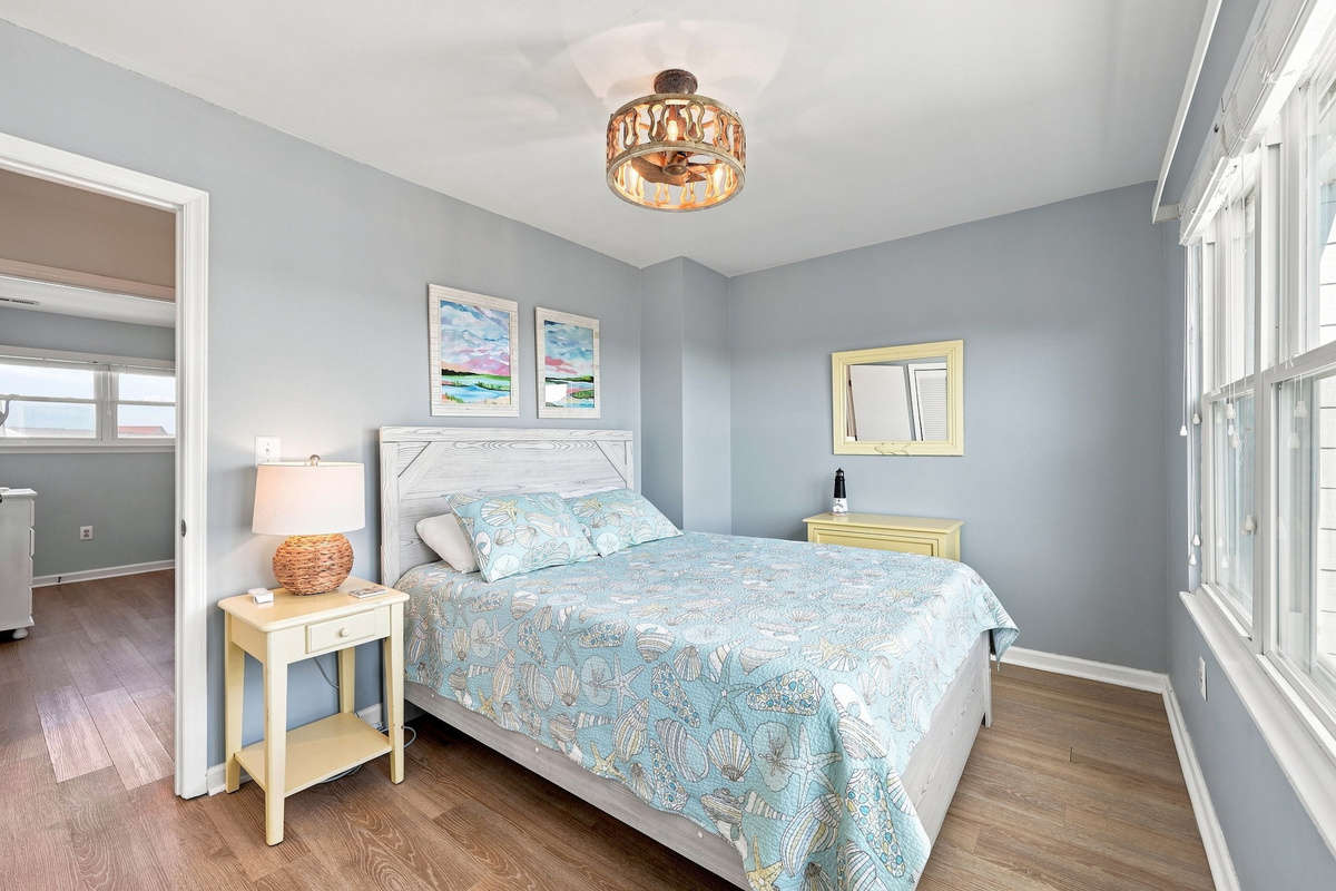 A cozy and inviting retreat featuring soothing coastal tones, perfect for relaxing after a long beach day.