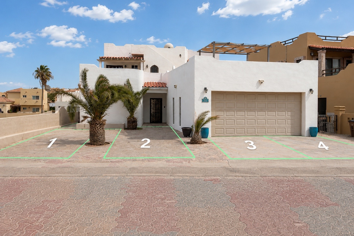 There are 4 parking spots in front of the house. 