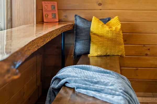 Game Room Window Bar with Live-Edge Table and Bench Seating.