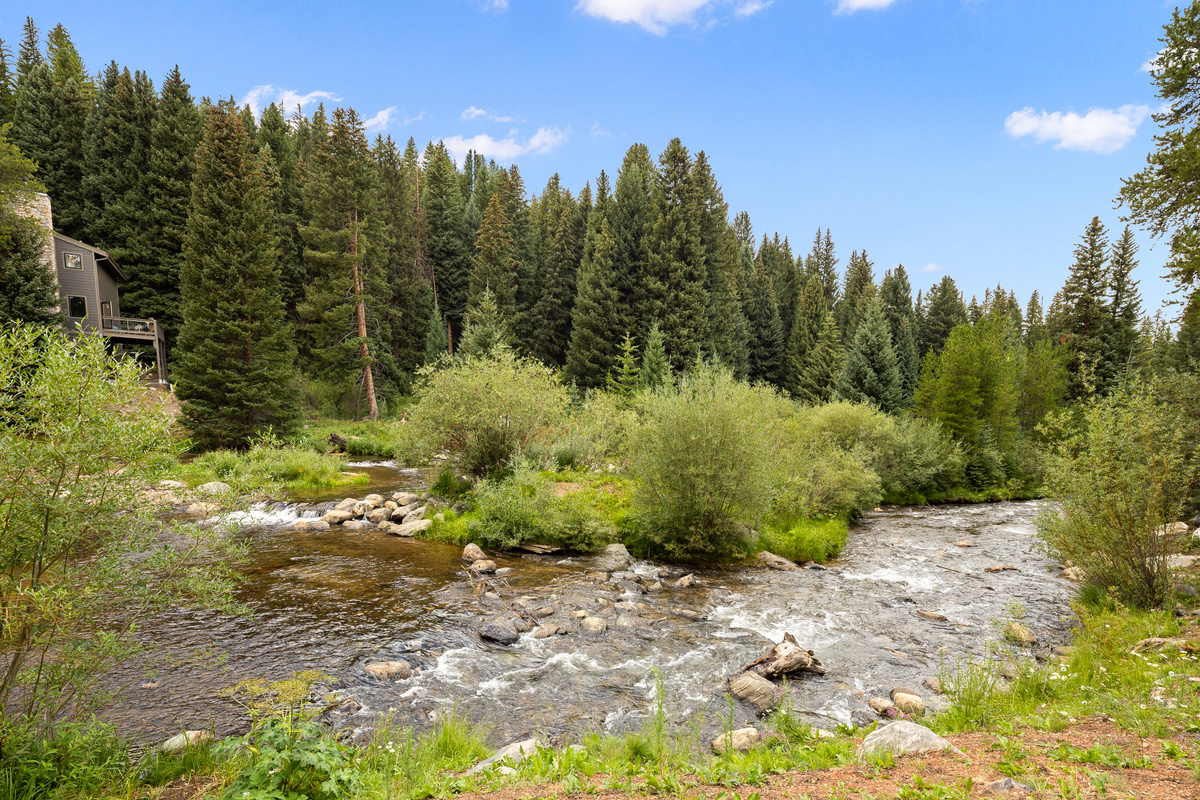 Riverside walking trails are just 80 yards out the door of Columbine Pine Creek Retreat