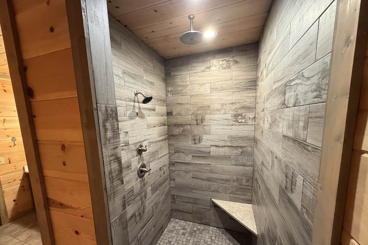 Downstairs luxurious master bathroom and overhead rain shower head.
