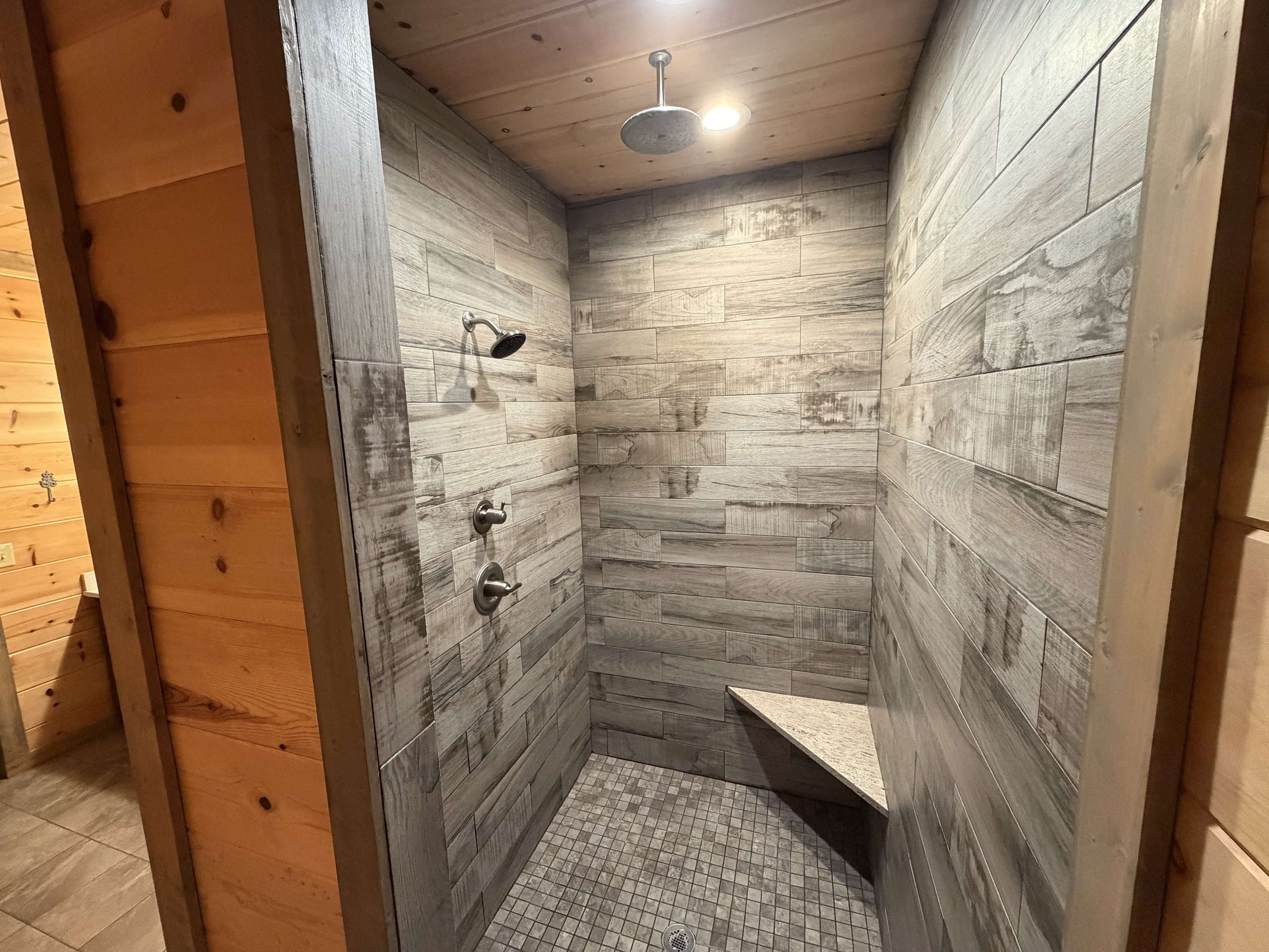 Downstairs luxurious master bathroom and overhead rain shower head.