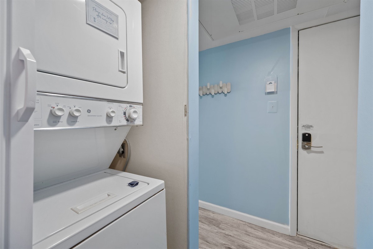 In-unit washer and dryer tucked away for added convenience during your stay