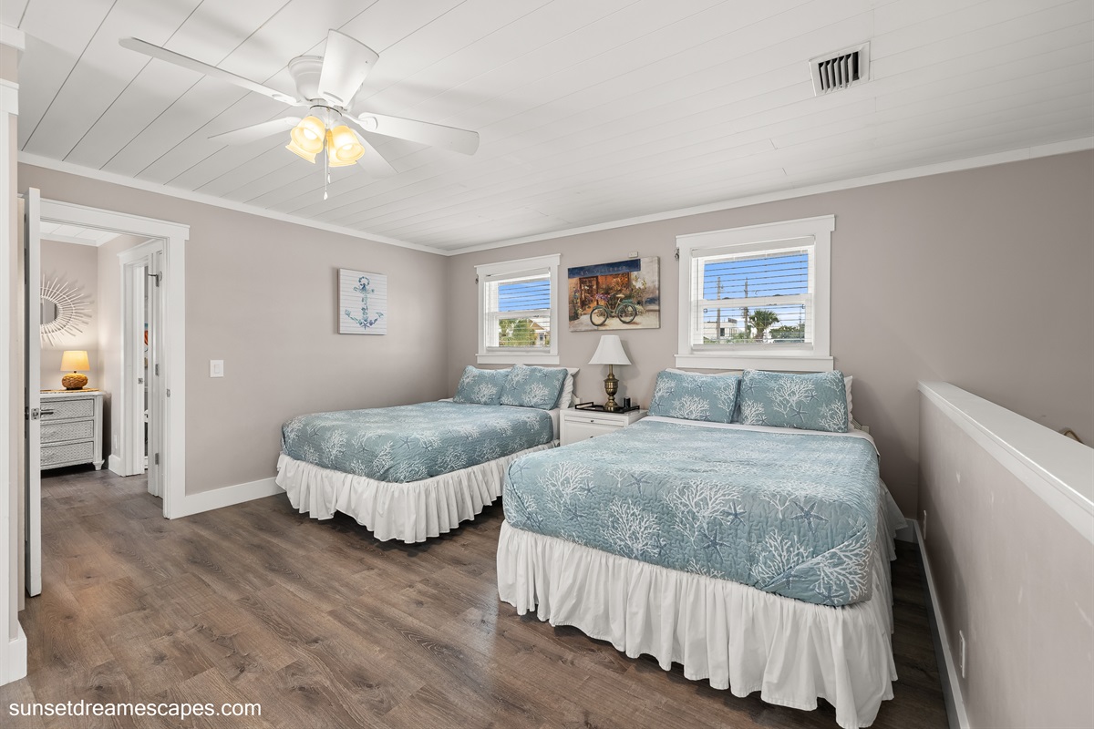 Steps from the secondary living room lead to the "Loft bedroom"  in rear section of the home. You can see the beautiful blue gulf ocean from the balcony!
