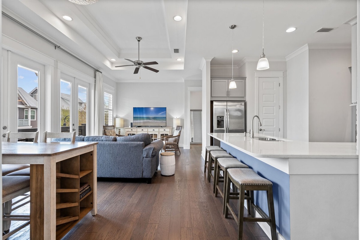 Bright open-concept kitchen and living area.