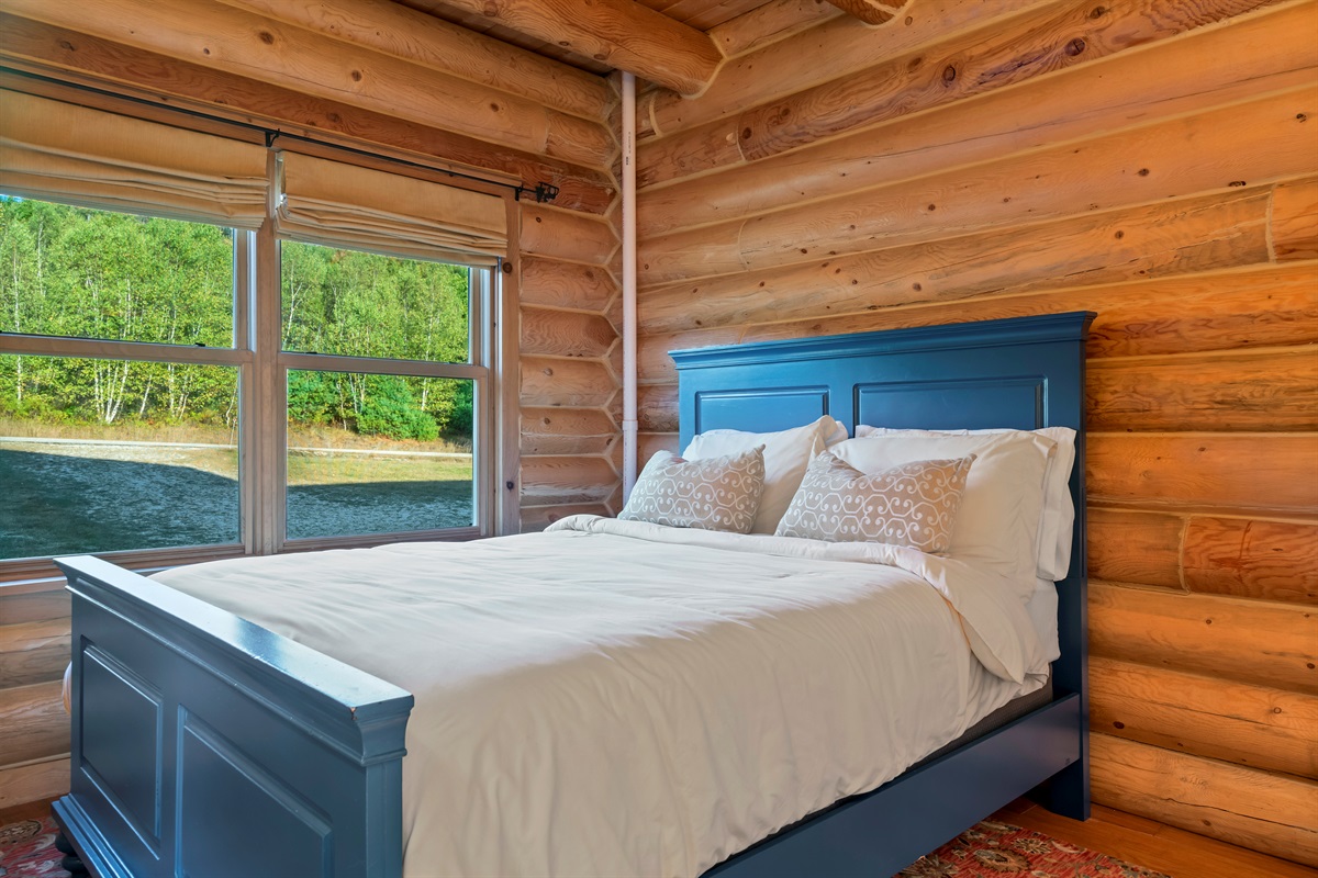 Relax in these cozy main level bedrooms with queen beds and dressers.