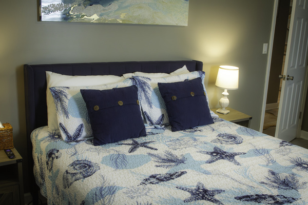A view of the bed in the master bedroom