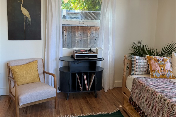 Fully functioning record player with vinyl provided from a local shop