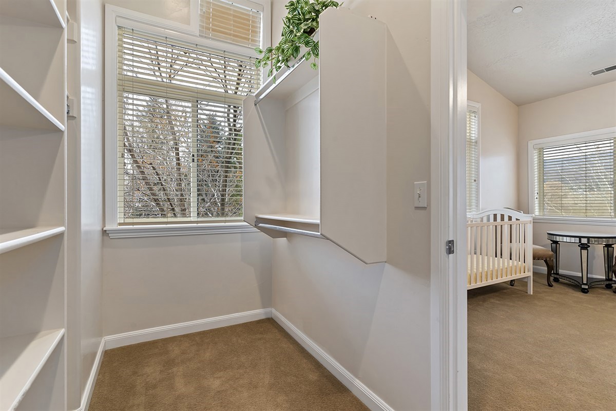 A generous walk-in closet adds convenience and luxury, providing ample storage for extended stays.