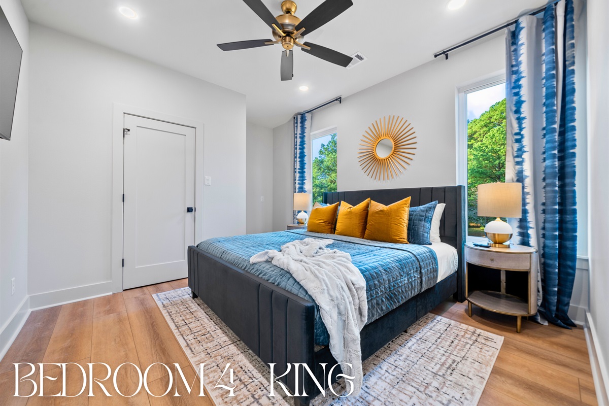 A cozy king bedroom perfect for reading or a quiet escape, adding a thoughtful touch to this beautifully designed space.