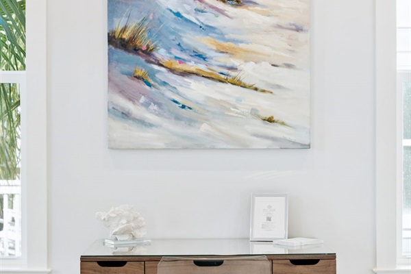 Second-floor master en suite featuring a king bed, smart TV, writing desk, large walk-in closet, and private screened-in balcony.