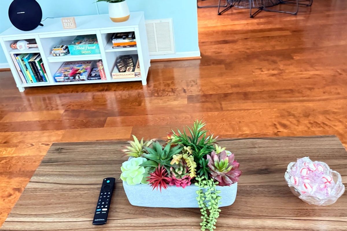 Coffee table centerpiece adds a natural, calming touch to the living room’s cozy design. 