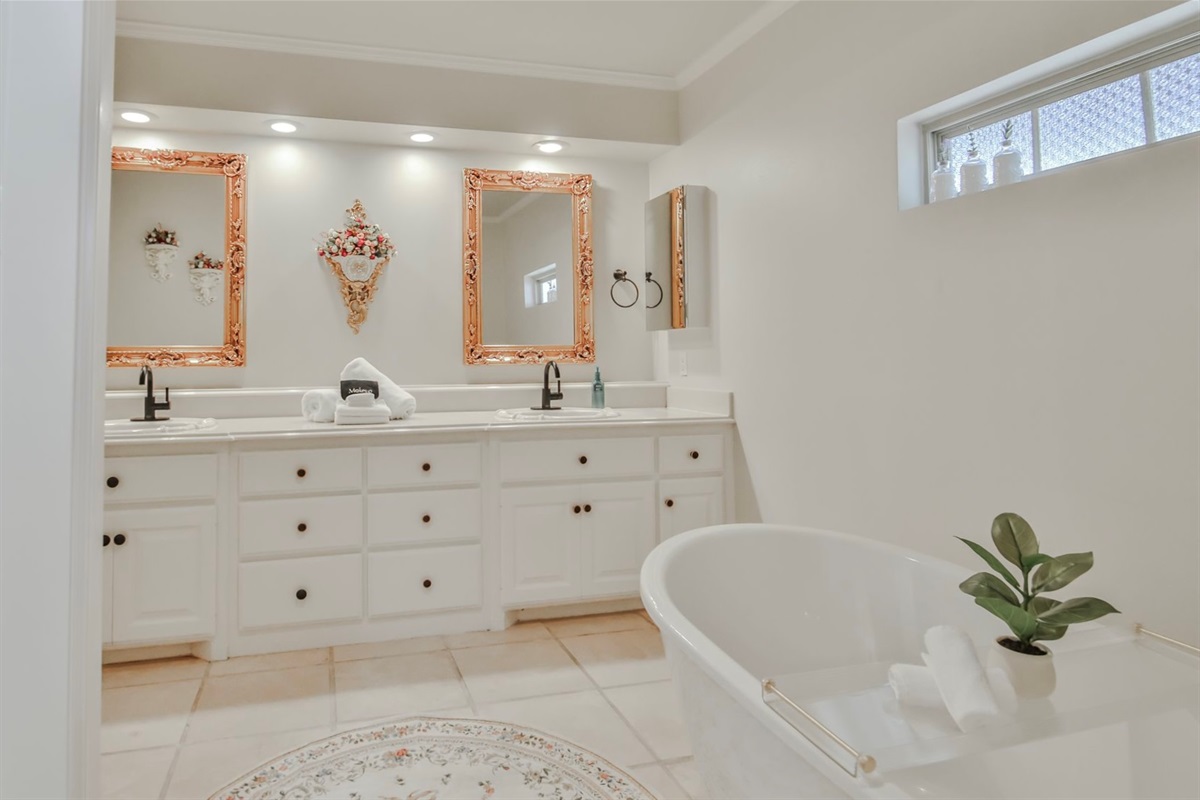 Slip into serenity - Surrounded by Victorian mirrors and an array of bath salts, the soaking tub awaits your most indulgent escape.