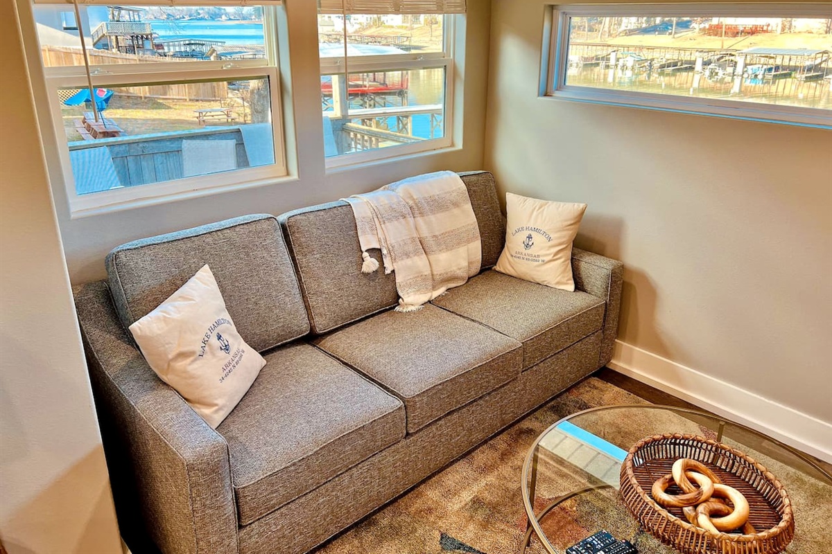 Living Room: Bright and inviting with stunning lake views and stylish decor for relaxing moments!