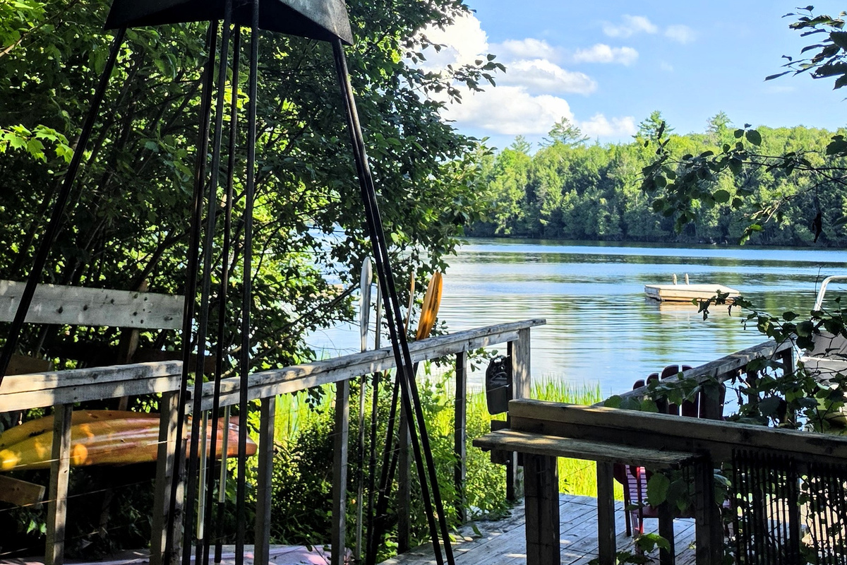Firepit area with view of dock and lake