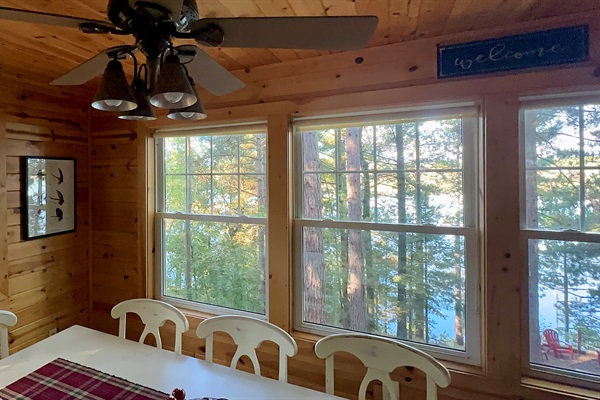 Dinner with a view - panoramic treetops and sparkling lake vistas right from the dining table.