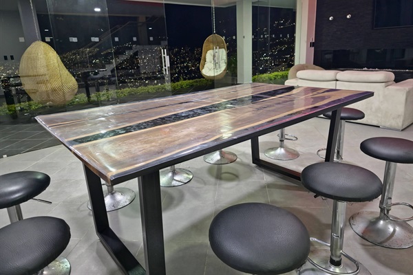 Dining table seats 10, with another 10 seats in storage