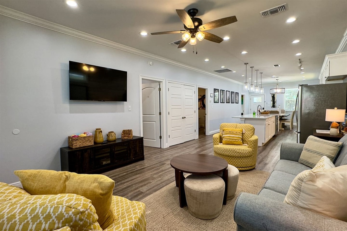 Where sleek design meets cozy charm—living room and kitchen in harmony