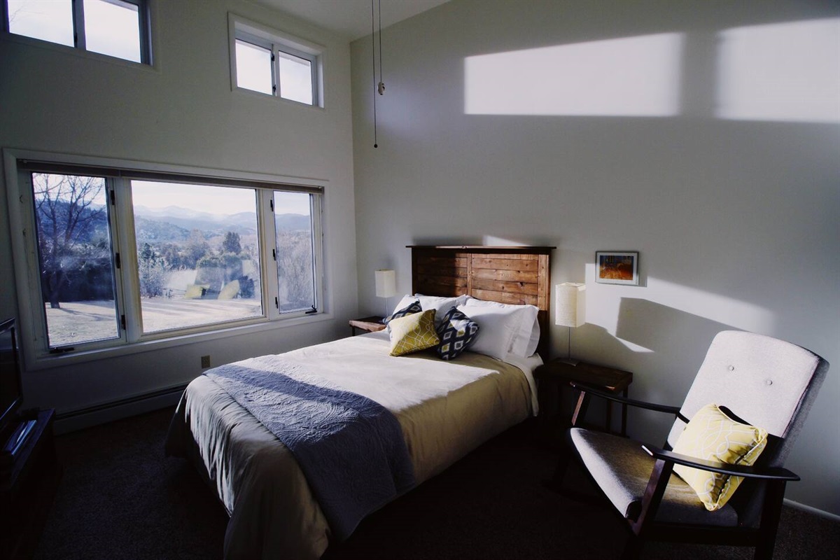 You'll find a bed that invites you to sink into blissful comfort, Adjacent to the bed, a restful chair beckons.