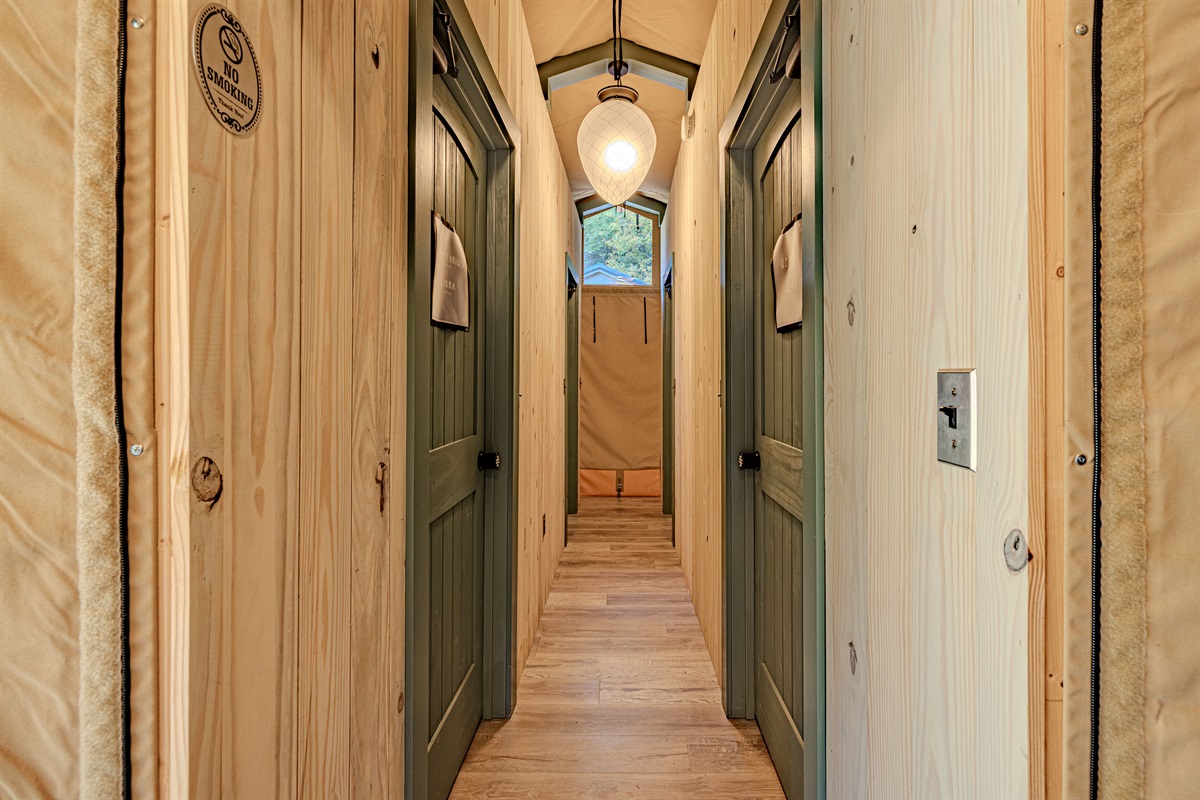 Find your sign! Each private bath stall is clearly marked, offering a dedicated space where you can enjoy hot showers and modern plumbing without ever feeling like you're camping.