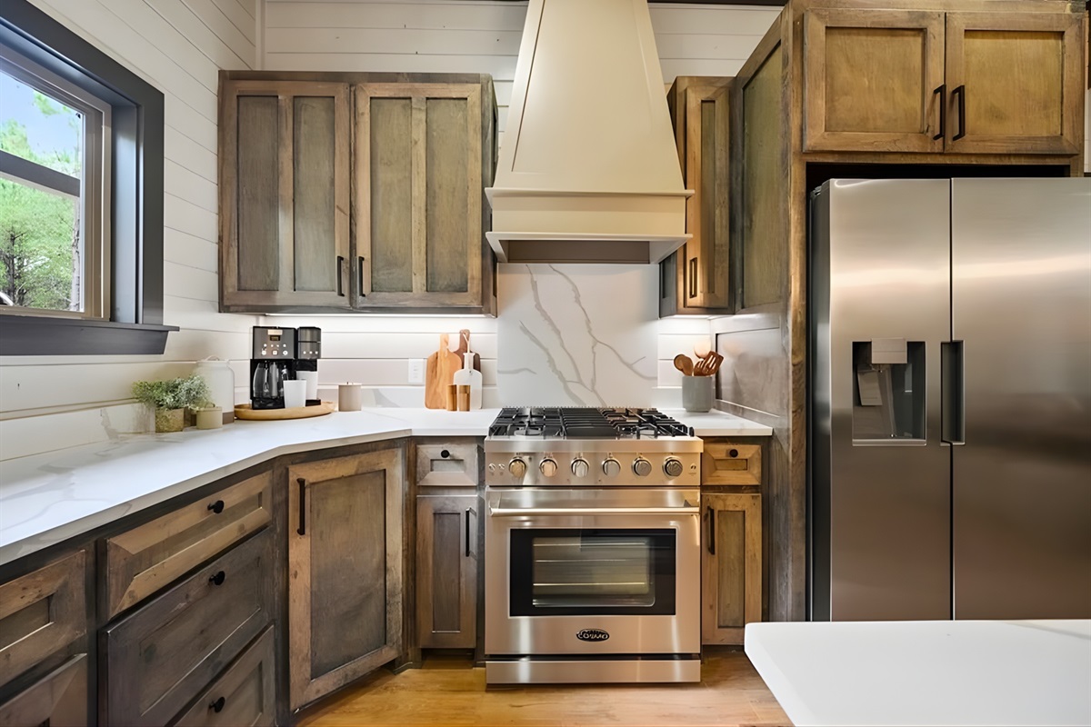 Warm wood cabinetry paired with stainless steel appliances gives this kitchen a stylish yet down-to-earth feel.