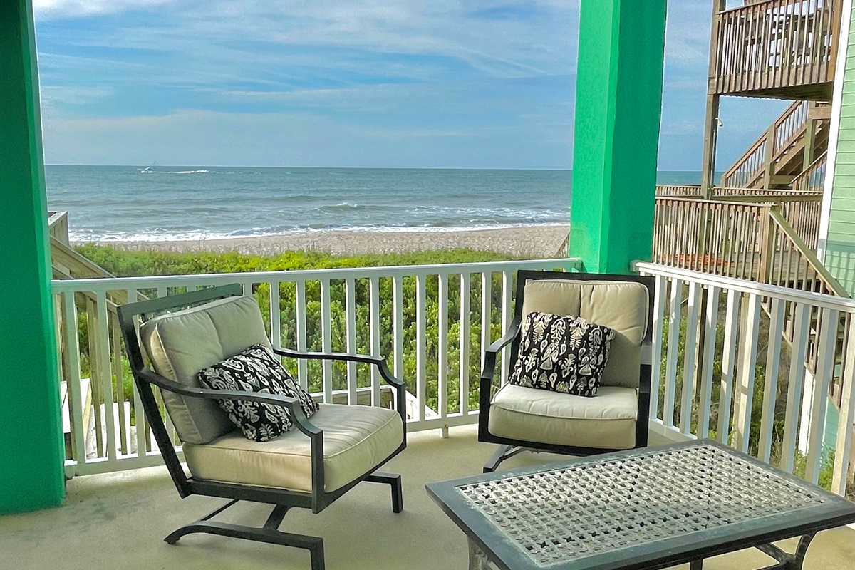 Stars - main level oceanfront deck with comfortable seating and dining